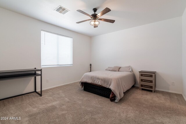 carpeted bedroom with ceiling fan