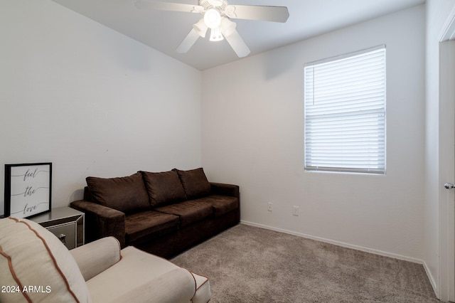 carpeted living room with plenty of natural light and ceiling fan