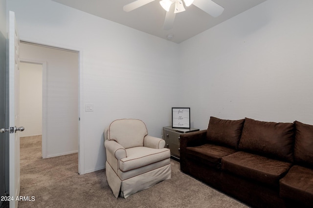 carpeted living room with ceiling fan