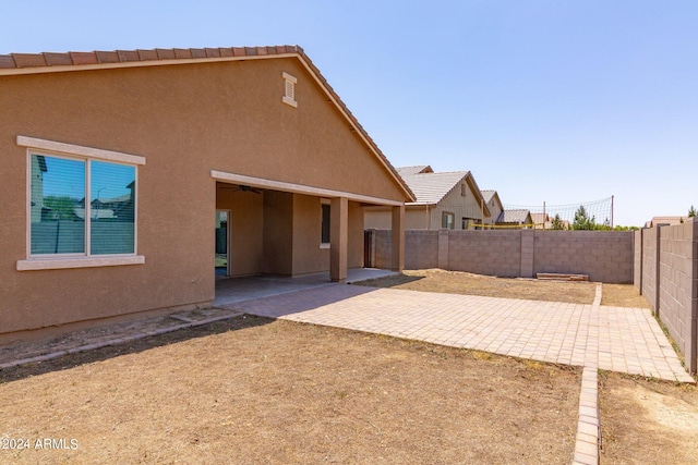 back of house with a patio