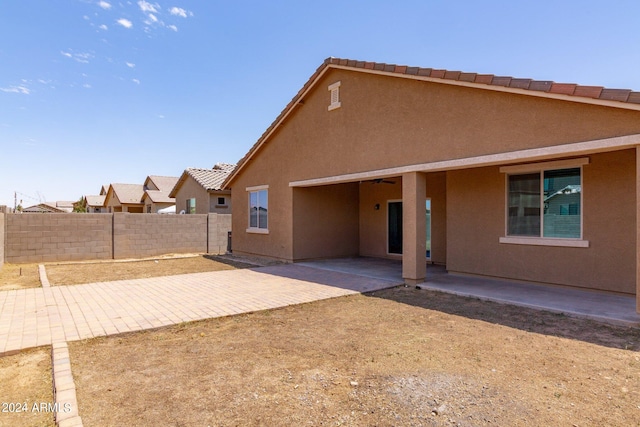 back of property featuring a patio