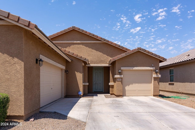 view of front of property with a garage