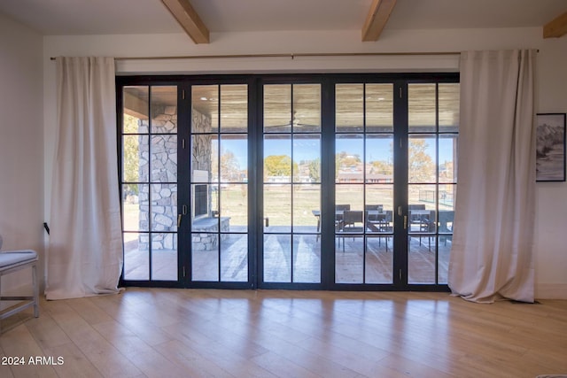 830 E Maverick, Taylor, AZ 85939 - doorway to outside featuring beam ceiling, hardwood / wood-style floors, and french doors