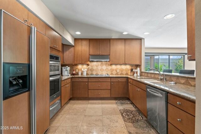 3033 E Claremont Ave, Phoenix, AZ 85016 - kitchen with a sink, under cabinet range hood, brown cabinets, a warming drawer, and stainless steel appliances