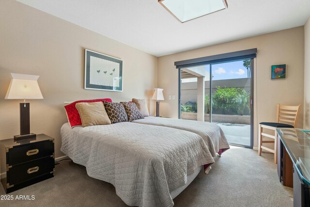 3033 E Claremont Ave, Phoenix, AZ 85016 - bedroom with access to exterior, carpet flooring, baseboards, and a skylight