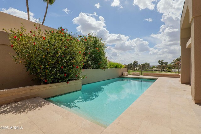 3033 E Claremont Ave, Phoenix, AZ 85016 - view of swimming pool featuring a fenced in pool, a patio, and fence