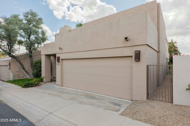 3033 E Claremont Ave, Phoenix, AZ 85016 - pueblo-style house featuring driveway and stucco siding