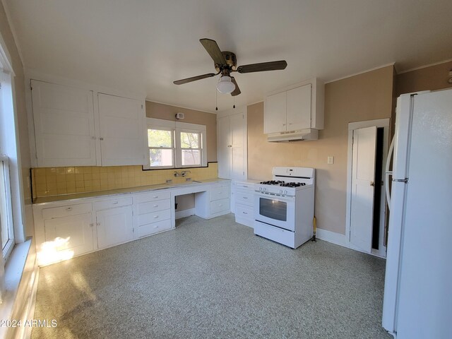 11 Black Knob Vw, Bisbee, AZ 85603 - kitchen with white appliances, under cabinet range hood, a ceiling fan, white cabinetry, and decorative backsplash