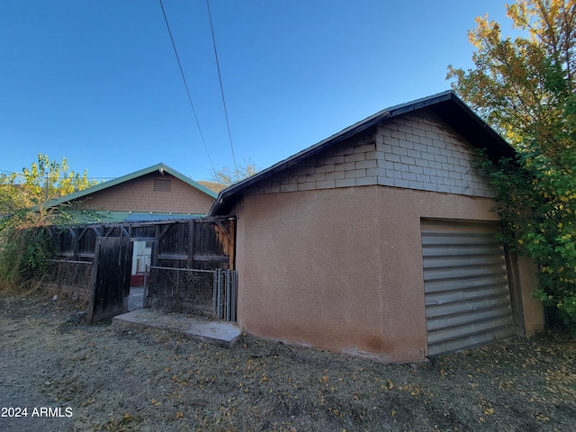 11 Black Knob Vw, Bisbee, AZ 85603 - view of side of property featuring fence, stucco siding, and an outbuilding
