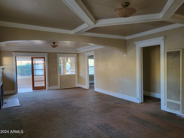 11 Black Knob Vw, Bisbee, AZ 85603 - unfurnished living room with a heating unit, arched walkways, ornamental molding, healthy amount of natural light, and carpet flooring