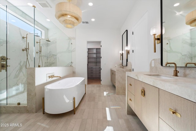 10541 E Windrose Dr, Scottsdale, AZ 85259 - bathroom with a marble finish shower, visible vents, two vanities, and a sink