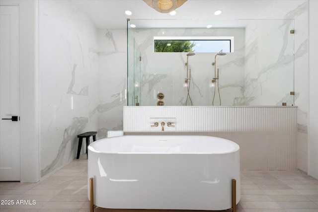 10541 E Windrose Dr, Scottsdale, AZ 85259 - bathroom featuring a freestanding bath, a marble finish shower, tile walls, and recessed lighting