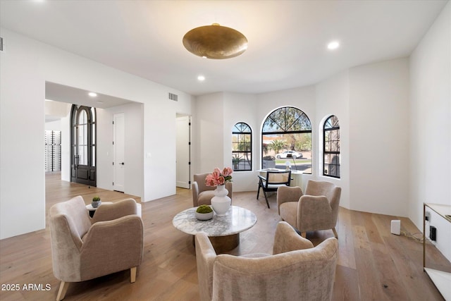 10541 E Windrose Dr, Scottsdale, AZ 85259 - living room with light wood finished floors, visible vents, and recessed lighting