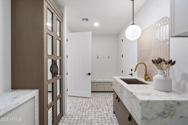10541 E Windrose Dr, Scottsdale, AZ 85259 - bathroom featuring recessed lighting, visible vents, a sink, and tile patterned floors