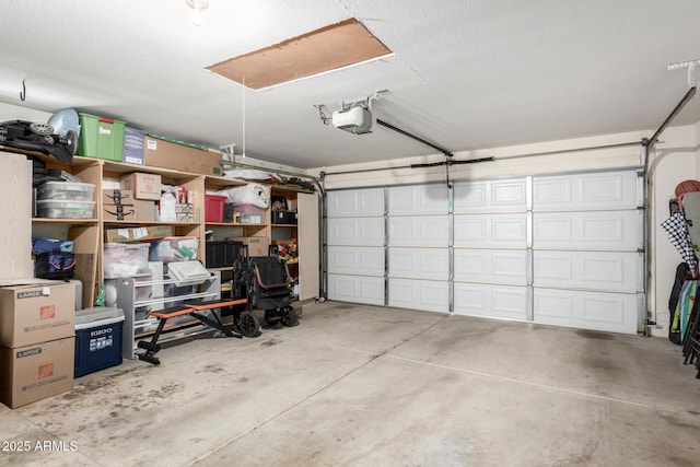 garage featuring a garage door opener