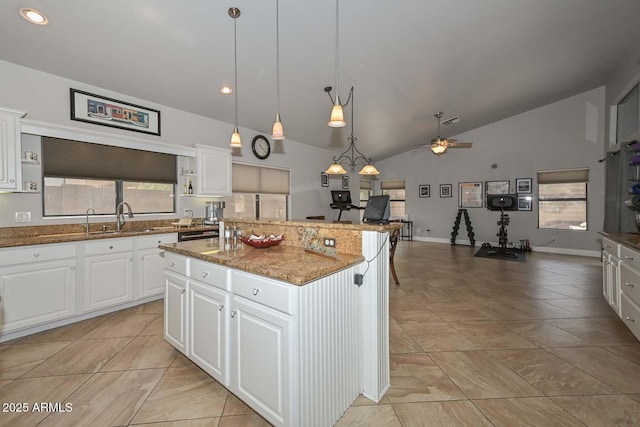 1623 E Runion Dr, Phoenix, AZ 85024 - kitchen featuring a sink, vaulted ceiling, a kitchen island, stone countertops, and open shelves