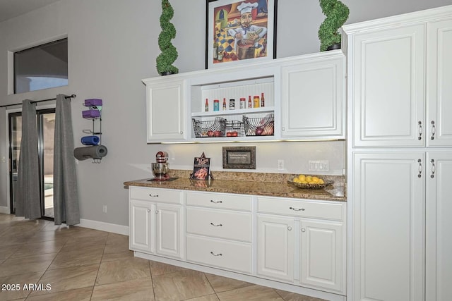 1623 E Runion Dr, Phoenix, AZ 85024 - kitchen with stone countertops, white cabinetry, baseboards, and light tile patterned floors