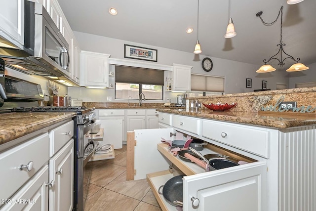 1623 E Runion Dr, Phoenix, AZ 85024 - kitchen with appliances with stainless steel finishes, white cabinets, hanging light fixtures, stone countertops, and recessed lighting