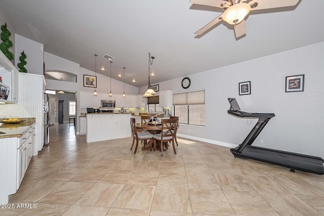 1623 E Runion Dr, Phoenix, AZ 85024 - dining room with lofted ceiling, ceiling fan, and baseboards