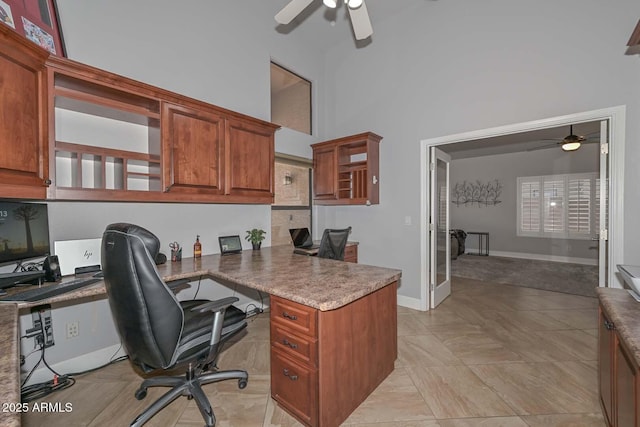 1623 E Runion Dr, Phoenix, AZ 85024 - office space with ceiling fan, baseboards, a towering ceiling, and built in study area