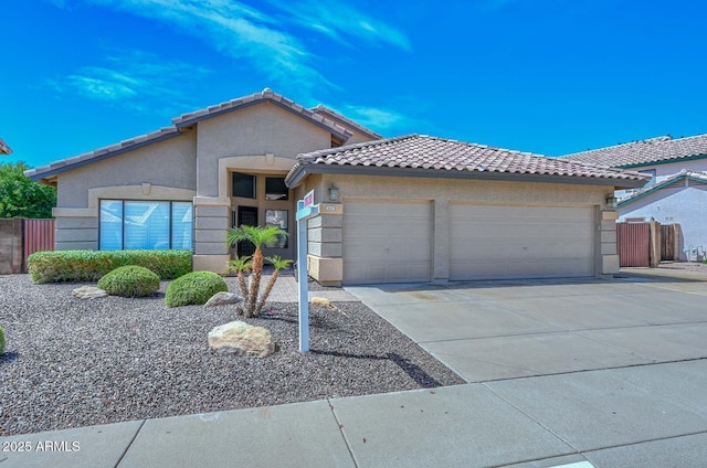 1623 E Runion Dr, Phoenix, AZ 85024 - view of front of home featuring a garage, a tile roof, stucco siding, and concrete driveway