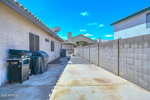 1623 E Runion Dr, Phoenix, AZ 85024 - fenced backyard featuring a patio, central air condition unit, and grilling area