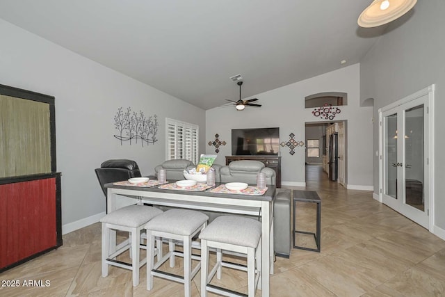 1623 E Runion Dr, Phoenix, AZ 85024 - dining area featuring a ceiling fan, baseboards, french doors, and high vaulted ceiling