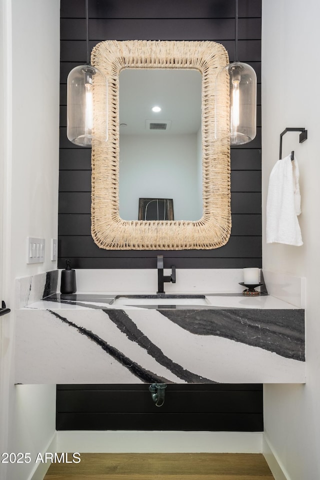 bathroom with visible vents and vanity