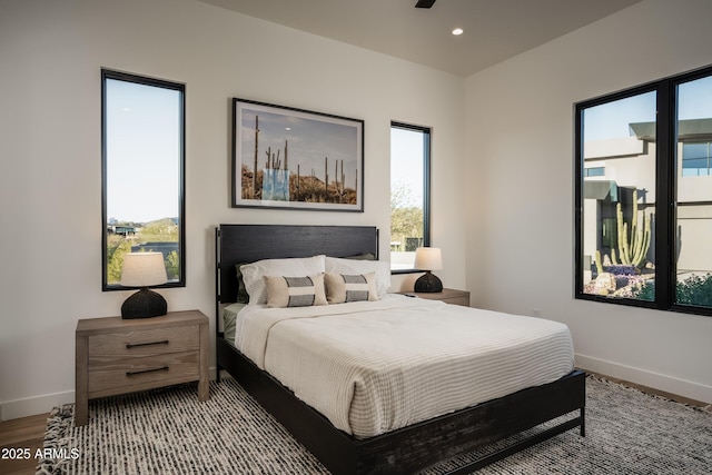 bedroom featuring light wood-style floors, baseboards, and recessed lighting