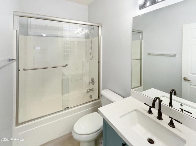 full bathroom with vanity, toilet, and combined bath / shower with glass door