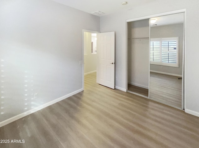 unfurnished bedroom with a closet