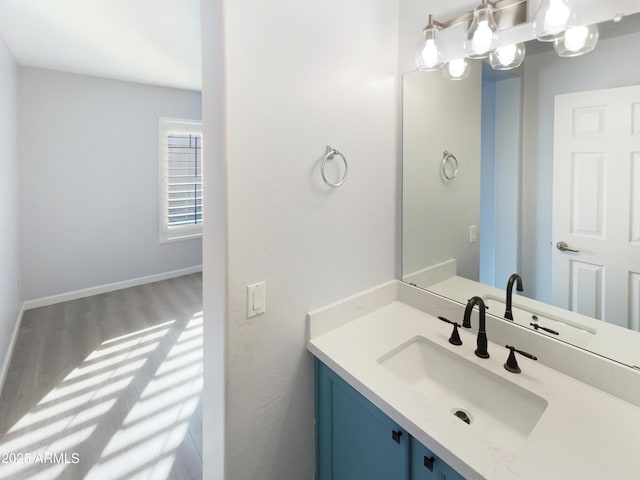 bathroom with vanity and hardwood / wood-style floors