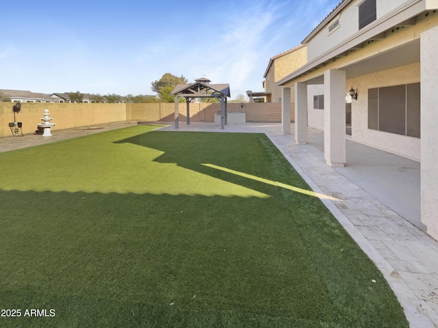 view of yard featuring a gazebo and a patio