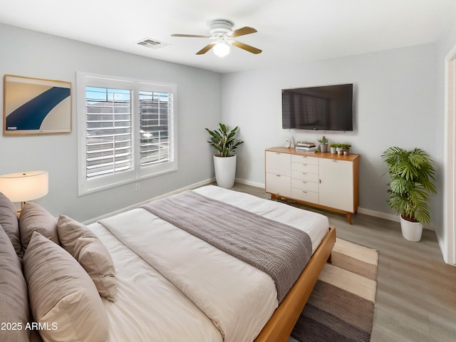 bedroom featuring ceiling fan and wood-type flooring