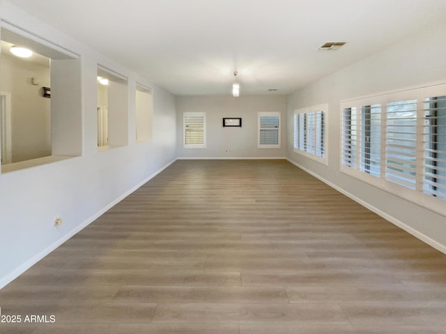 spare room featuring hardwood / wood-style flooring