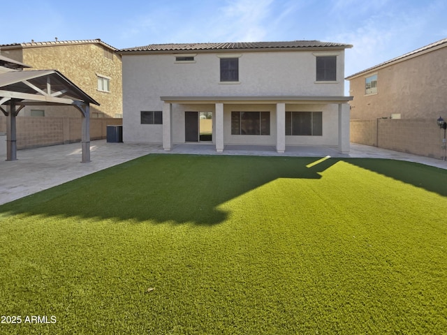 rear view of property featuring a patio