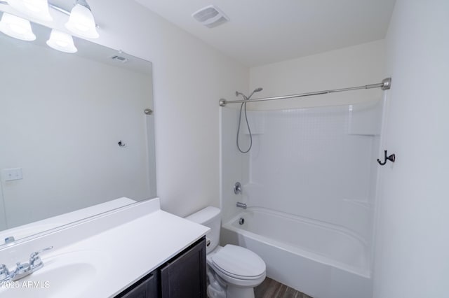 full bathroom with hardwood / wood-style flooring, vanity, shower / bath combination, and toilet