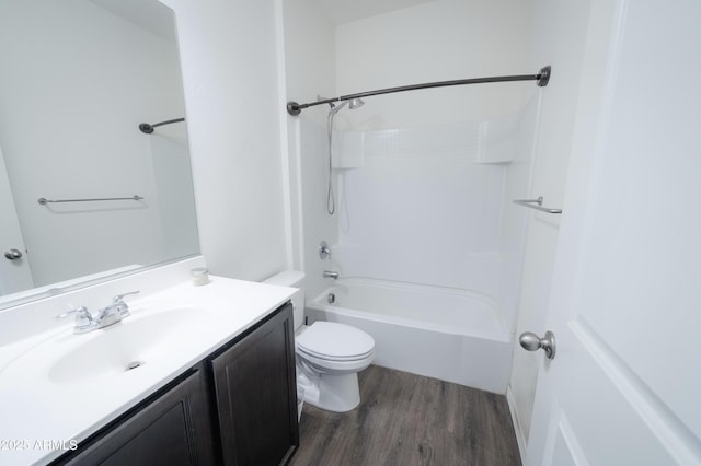 full bathroom featuring shower / tub combination, vanity, hardwood / wood-style flooring, and toilet