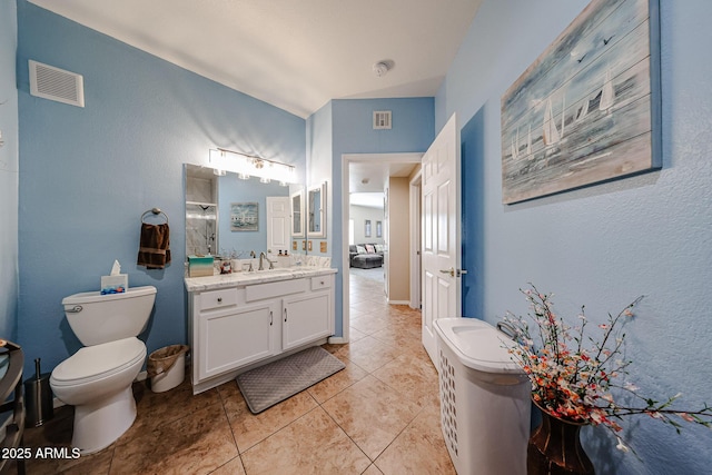 10030 W Indian School Rd Unit 101, Phoenix, AZ 85037 - bathroom featuring vanity, a shower with door, and tile patterned floors