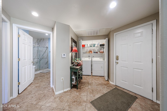10030 W Indian School Rd Unit 101, Phoenix, AZ 85037 - laundry area featuring washer and dryer and light tile patterned flooring