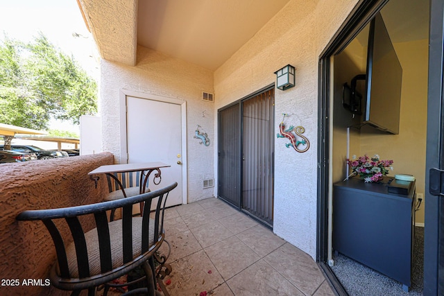 10030 W Indian School Rd Unit 101, Phoenix, AZ 85037 - entrance to property featuring a balcony and stucco siding
