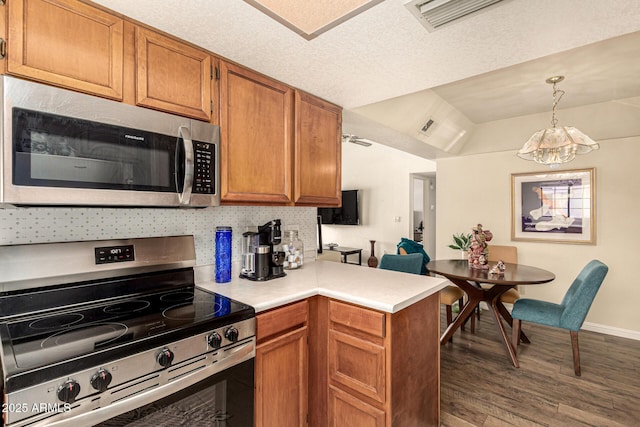 839 S Westwood Unit 287, Mesa, AZ 85210 - kitchen featuring appliances with stainless steel finishes, wood finished floors, light countertops, brown cabinets, and baseboards