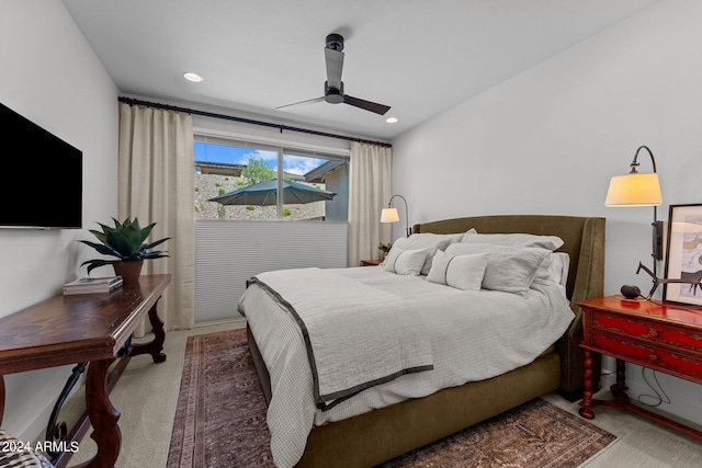 carpeted bedroom with ceiling fan