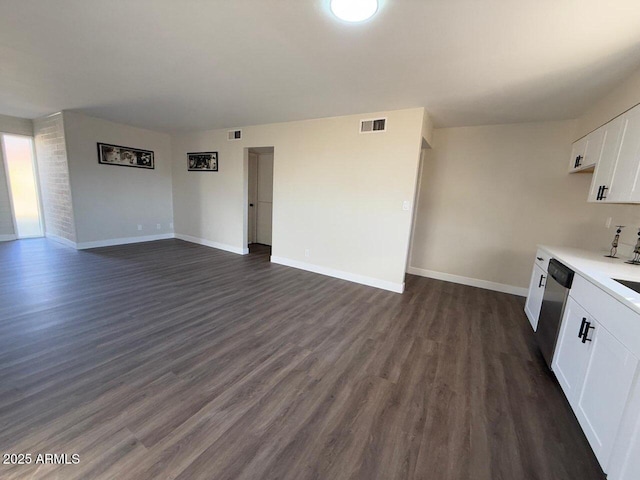 unfurnished living room featuring dark hardwood / wood-style floors