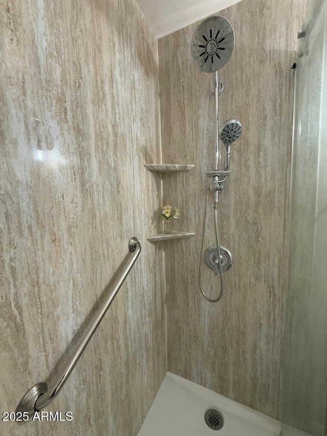 bathroom with a tile shower