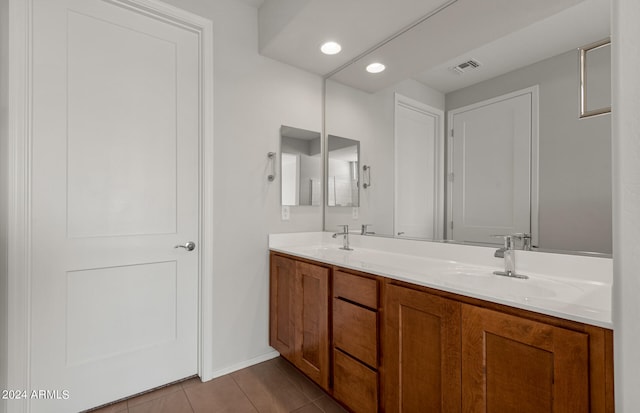 bathroom with vanity and tile patterned flooring