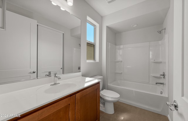 full bathroom with vanity, toilet, tile patterned floors, and tub / shower combination