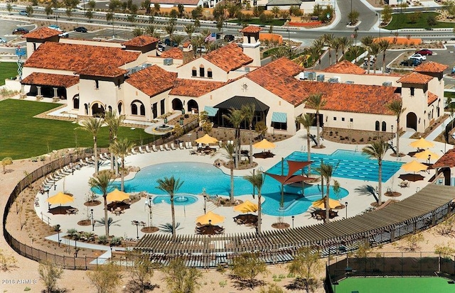 view of swimming pool with a patio and a water slide