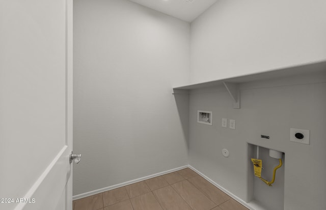 laundry room with hookup for a washing machine, light tile patterned flooring, gas dryer hookup, and hookup for an electric dryer