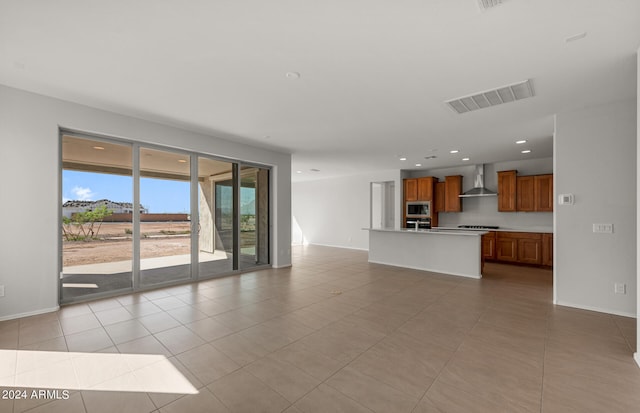 unfurnished living room with light tile patterned floors